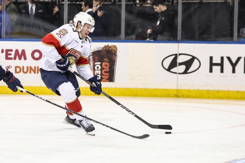 Oct 24, 2024; New York, New York, USA;  Florida Panthers center Carter Verhaeghe (23) controls the puck in the first period against the New York Rangers at Madison Square Garden. Mandatory Credit: Wendell Cruz-Imagn Images