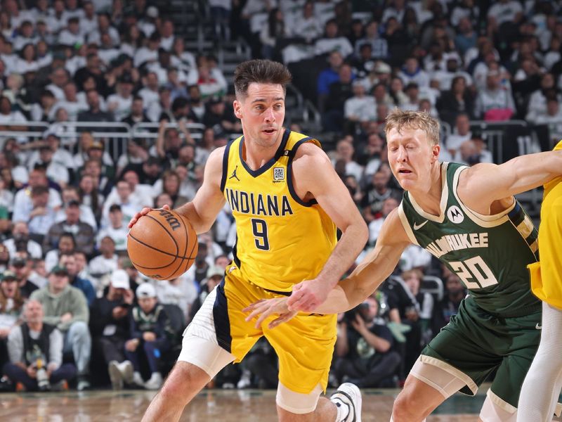 MILWAUKEE, WI - APRIL 23: T.J. McConnell #9 of the Indiana Pacers handles the ball during Round 1 Game 2 of the 2024 NBA Playoffs against the Milwaukee Bucks on April 23, 2024 at the Fiserv Forum Center in Milwaukee, Wisconsin. NOTE TO USER: User expressly acknowledges and agrees that, by downloading and or using this Photograph, user is consenting to the terms and conditions of the Getty Images License Agreement. Mandatory Copyright Notice: Copyright 2024 NBAE (Photo by Jeff Haynes/NBAE via Getty Images).