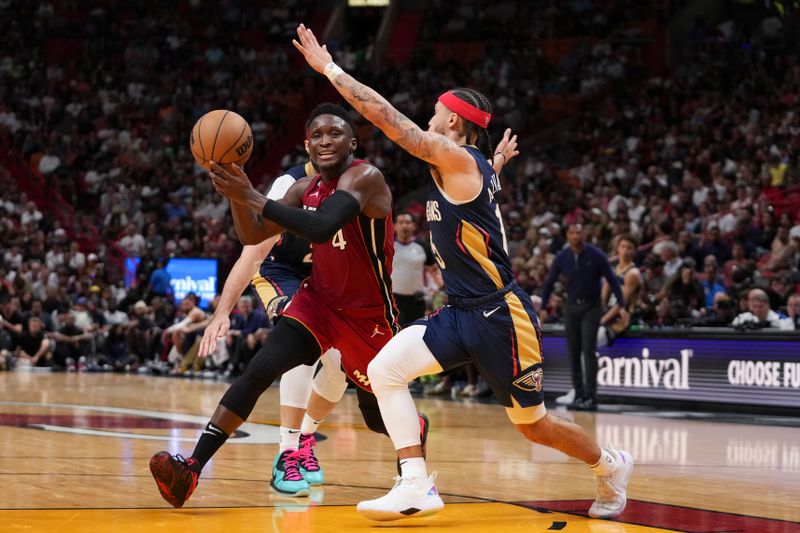 MIAMI, FLORIDA - JANUARY 22: Victor Oladipo #4 of the Miami Heat drives to the basket while being defended by Jose Alvarado #15 of the New Orleans Pelicans during the second half at Miami-Dade Arena on January 22, 2023 in Miami, Florida. NOTE TO USER: User expressly acknowledges and agrees that,? by downloading and or using this photograph,? User is consenting to the terms and conditions of the Getty Images License Agreement. (Photo by Eric Espada/Getty Images)