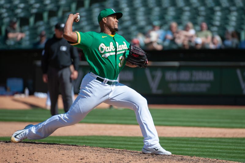 Apr 29, 2023; Oakland, California, USA; Oakland Athletics relief pitcher Jeurys Familia (31) throws a pitch during the ninth inning against the Cincinnati Reds at RingCentral Coliseum. Mandatory Credit: Ed Szczepanski-USA TODAY Sports