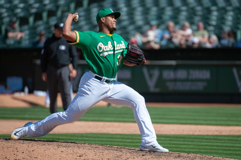 Apr 29, 2023; Oakland, California, USA; Oakland Athletics relief pitcher Jeurys Familia (31) throws a pitch during the ninth inning against the Cincinnati Reds at RingCentral Coliseum. Mandatory Credit: Ed Szczepanski-USA TODAY Sports