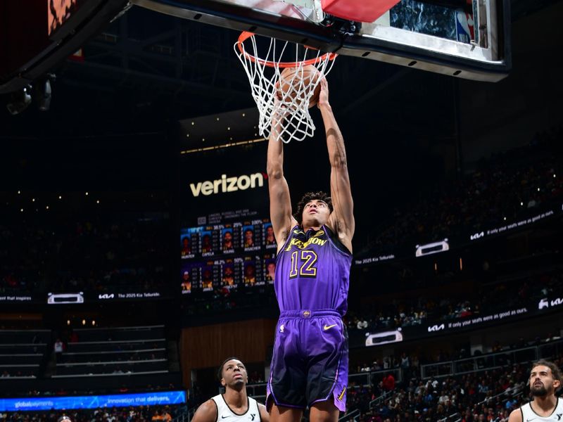 ATLANTA, GA - DECEMBER 6: Max Christie #12 of the Los Angeles Lakers drives to the basket during the game against the Atlanta Hawks on December 6, 2024 at State Farm Arena in Atlanta, Georgia.  NOTE TO USER: User expressly acknowledges and agrees that, by downloading and/or using this Photograph, user is consenting to the terms and conditions of the Getty Images License Agreement. Mandatory Copyright Notice: Copyright 2024 NBAE (Photo by Scott Cunningham/NBAE via Getty Images)