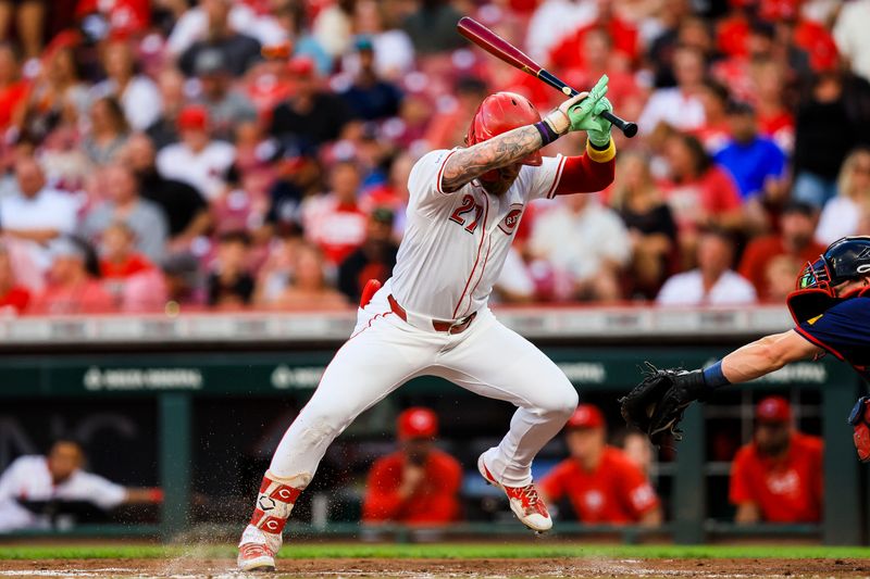 Sep 18, 2024; Cincinnati, Ohio, USA; Cincinnati Reds outfielder Jake Fraley (27) dodges a wild pitch in the third inning against the Atlanta Braves at Great American Ball Park. Mandatory Credit: Katie Stratman-Imagn Images