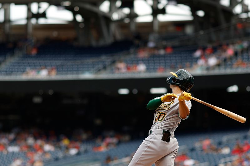 Aug 13, 2023; Washington, District of Columbia, USA; Oakland Athletics second baseman Zack Gelof (20) hits a home run against the Washington Nationals during the first inning at Nationals Park. Mandatory Credit: Geoff Burke-USA TODAY Sports