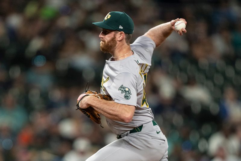 May 11, 2024; Seattle, Washington, USA; Oakland Athletics reliever Michael Kelly (47) delivers a pitch during the ninth inning against the Seattle Mariners at T-Mobile Park. Mandatory Credit: Stephen Brashear-USA TODAY Sports