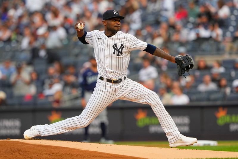 Jun 22, 2023; Bronx, New York, USA; New York Yankees pitcher Domingo German (0) delivers a pitch against the Seattle Mariners during the first inning at Yankee Stadium. Mandatory Credit: Gregory Fisher-USA TODAY Sports