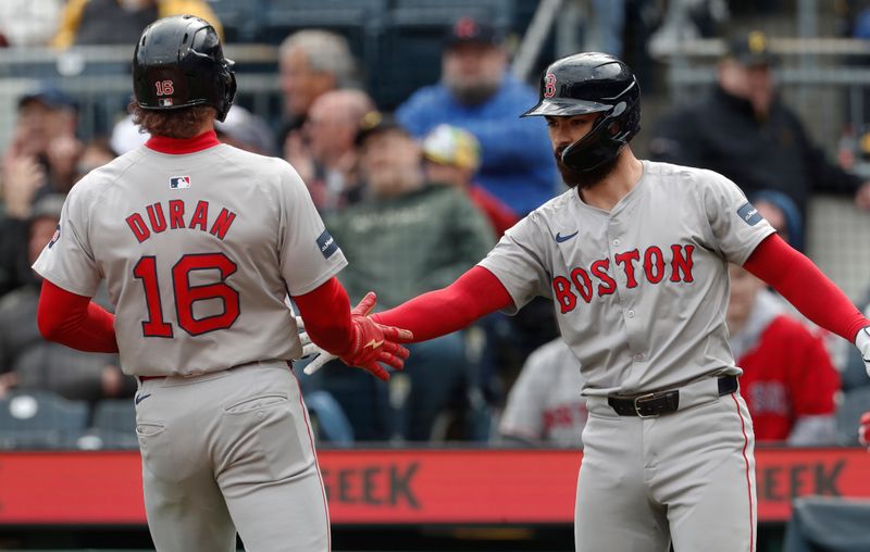 Apr 21, 2024; Pittsburgh, Pennsylvania, USA;  Boston Red Sox catcher Connor Wong (right) congratulates center fielder outfielder Jarren Duran (16) after Duran scored a run on an error by the Pittsburgh Pirates during the eighth inning at PNC Park. Boston won 6-1. Mandatory Credit: Charles LeClaire-USA TODAY Sports