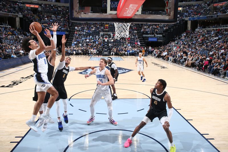 MEMPHIS, TN - JANUARY 26:  Anthony Black #0 of the Orlando Magic drives to the basket during the game against the Memphis Grizzlies on January 26, 2024 at FedExForum in Memphis, Tennessee. NOTE TO USER: User expressly acknowledges and agrees that, by downloading and or using this photograph, User is consenting to the terms and conditions of the Getty Images License Agreement. Mandatory Copyright Notice: Copyright 2024 NBAE (Photo by Joe Murphy/NBAE via Getty Images)