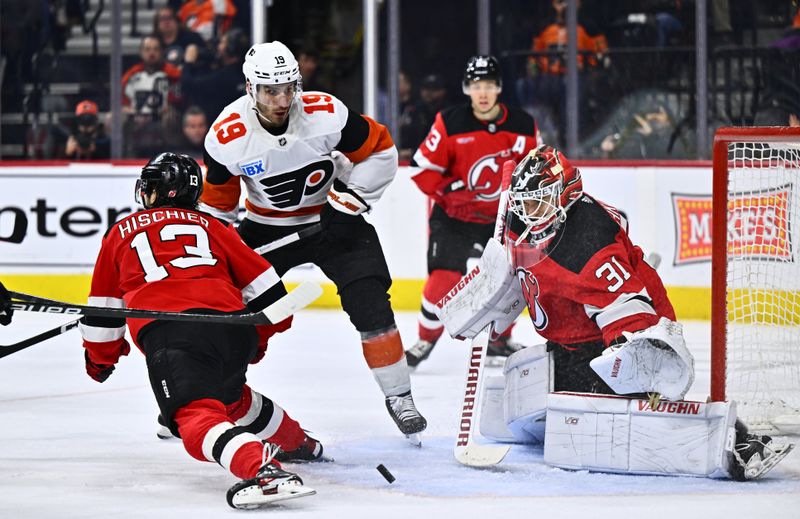 Apr 13, 2024; Philadelphia, Pennsylvania, USA; New Jersey Devils goalie Kaapo Kahkonen (31) defends a shot against Philadelphia Flyers right wing Garnet Hathaway (19) in the third period at Wells Fargo Center. Mandatory Credit: Kyle Ross-USA TODAY Sports