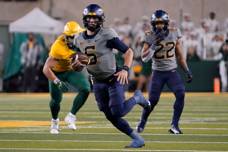 Nov 25, 2023; Waco, Texas, USA; West Virginia Mountaineers quarterback Garrett Greene (6) carries the ball against the Baylor Bears during the second half at McLane Stadium. Mandatory Credit: Raymond Carlin III-USA TODAY Sports