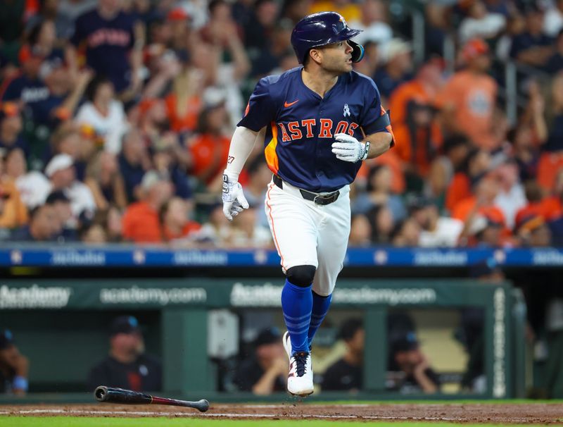 Jun 16, 2024; Houston, Texas, USA; Houston Astros second baseman Jose Altuve (27) hits a three-run home run against the Detroit Tigers in the second inning at Minute Maid Park. Mandatory Credit: Thomas Shea-USA TODAY Sports