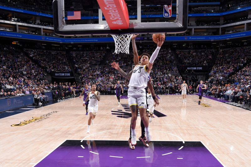 SACRAMENTO, CA - DECEMBER 8: Keyonte George #3 of the Utah Jazz drives to the basket during the game against the Sacramento Kings on December 8, 2024 at Golden 1 Center in Sacramento, California. NOTE TO USER: User expressly acknowledges and agrees that, by downloading and or using this Photograph, user is consenting to the terms and conditions of the Getty Images License Agreement. Mandatory Copyright Notice: Copyright 2024 NBAE (Photo by Rocky Widner/NBAE via Getty Images)