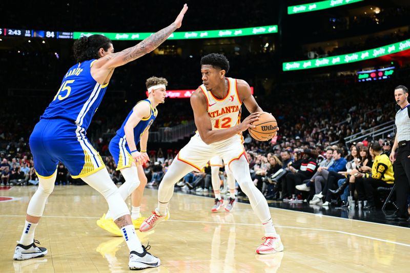 ATLANTA, GA - FEBRUARY 3: De'Andre Hunter #12 of the Atlanta Hawks handles the ball during the game  against the Golden State Warriors on February 3, 2024 at State Farm Arena in Atlanta, Georgia.  NOTE TO USER: User expressly acknowledges and agrees that, by downloading and/or using this Photograph, user is consenting to the terms and conditions of the Getty Images License Agreement. Mandatory Copyright Notice: Copyright 2024 NBAE (Photo by Adam Hagy/NBAE via Getty Images)