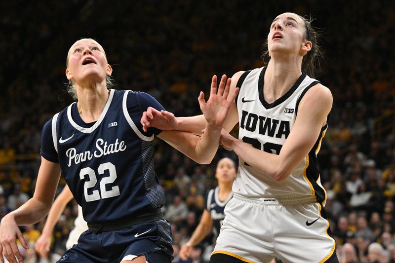 Feb 8, 2024; Iowa City, Iowa, USA; Iowa Hawkeyes guard Caitlin Clark (22) and Penn State Nittany Lions guard Alli Campbell (22) battle for a rebound during the first half at Carver-Hawkeye Arena. Mandatory Credit: Jeffrey Becker-USA TODAY Sports