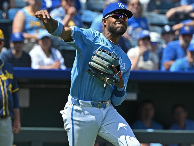 May 8, 2024; Kansas City, Missouri, USA;  Kansas City Royals third baseman Maikel Garcia (11) throws the ball to first base in the third inning against the Milwaukee Brewers at Kauffman Stadium. Mandatory Credit: Peter Aiken-USA TODAY Sports