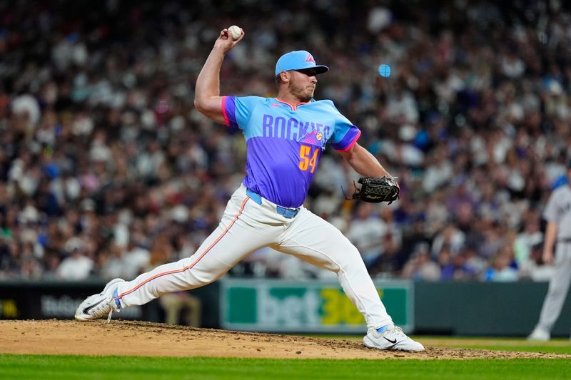 May 23, 2025; Denver, Colorado, USA; Colorado Rockies relief pitcher Zach Agnos (36) delivers a pitch in the ninth inning against the New York Yankees at Coors Field. Mandatory Credit: Ron Chenoy-Imagn Images