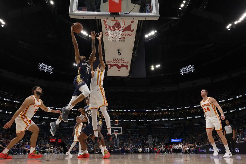 CHICAGO, IL - NOVEMBER 3: Jalen Crutcher #11 of the New Orleans Pelicans drives to the basket during the game against the Atlanta Hawks on November 3, 2024 at United Center in Chicago, Illinois. NOTE TO USER: User expressly acknowledges and agrees that, by downloading and or using this photograph, User is consenting to the terms and conditions of the Getty Images License Agreement. Mandatory Copyright Notice: Copyright 2024 NBAE (Photo by Jeff Haynes/NBAE via Getty Images)