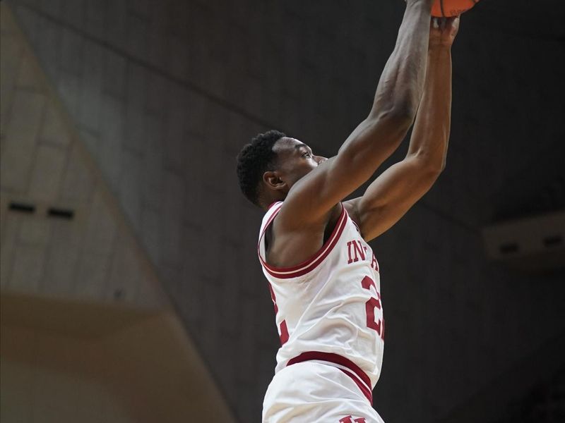 Nov 23, 2022; Bloomington, Indiana, USA;  Indiana Hoosiers forward Jordan Geronimo (22) rises up for a dunk during the first half at Simon Skjodt Assembly Hall. Mandatory Credit: Robert Goddin-USA TODAY Sports