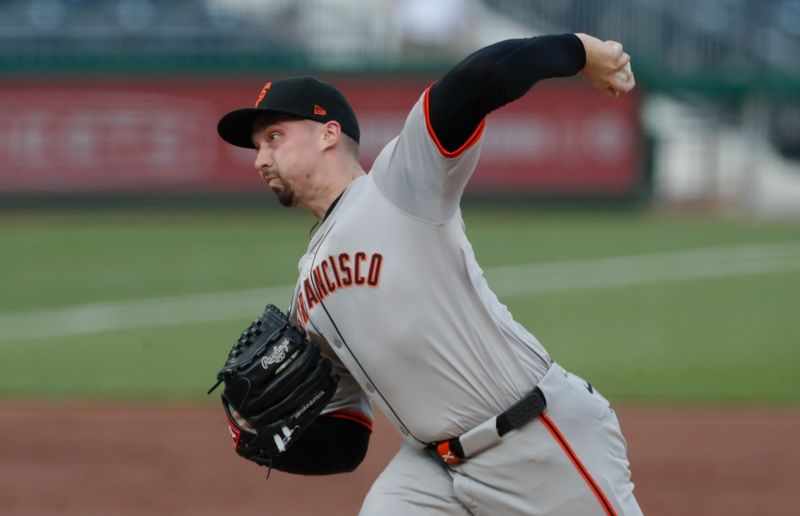 May 22, 2024; Pittsburgh, Pennsylvania, USA;  San Francisco Giants starting pitcher Blake Snell (7) delivers a pitch against the Pittsburgh Pirates during the first inning at PNC Park. Mandatory Credit: Charles LeClaire-USA TODAY Sports