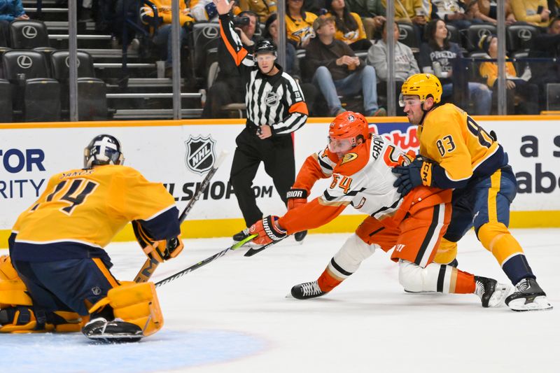 Oct 21, 2025; Nashville, Tennessee, USA;  Nashville Predators defenseman Adam Wilsby (83) grabs Anaheim Ducks center Mikael Granlund (64) as he skates to the net during the second period at Bridgestone Arena. Mandatory Credit: Steve Roberts-Imagn Images