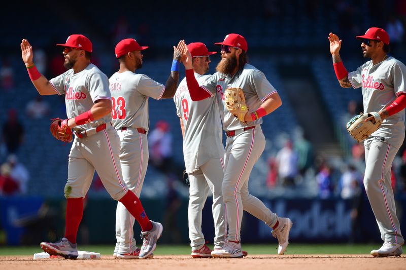 May 1, 2024; Anaheim, California, USA; Philadelphia Phillies celebrate the victory against the Los Angeles Angels at Angel Stadium. Mandatory Credit: Gary A. Vasquez-USA TODAY Sports