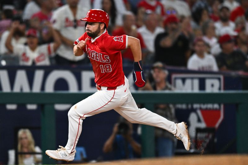 Aug 17, 2024; Anaheim, California, USA; Los Angeles Angels first baseman Nolan Schanuel (18) runs to home plate to score against the Atlanta Braves during the X inning at Angel Stadium. Mandatory Credit: Jonathan Hui-USA TODAY Sports