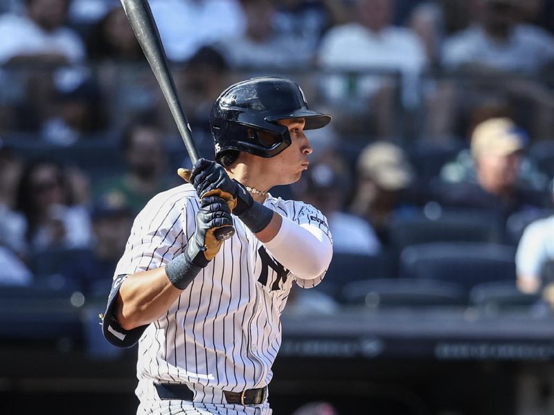 Sep 15, 2024; Bronx, New York, USA;  New York Yankees first baseman Oswaldo Cabrera (95) hits a single in the sixth inning against the Boston Red Sox at Yankee Stadium. Mandatory Credit: Wendell Cruz-Imagn Images