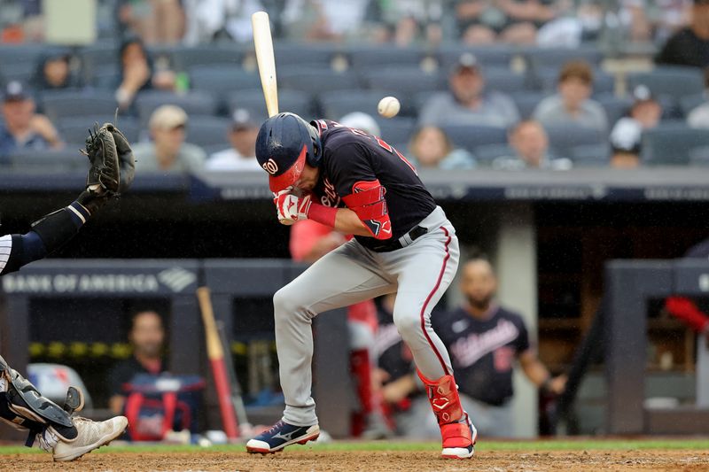 Aug 24, 2023; Bronx, New York, USA; Washington Nationals right fielder Lane Thomas (28) is hit in the helmet by a pitch during the ninth inning against the New York Yankees at Yankee Stadium. Mandatory Credit: Brad Penner-USA TODAY Sports