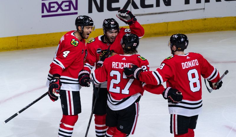 Apr 6, 2024; Chicago, Illinois, USA; Chicago Blackhawks center Andreas Athanasiou (89) celebrates with teammates after scoring a goal against the Dallas Stars during the second period at United Center. Mandatory Credit: Seeger Gray-USA TODAY Sports