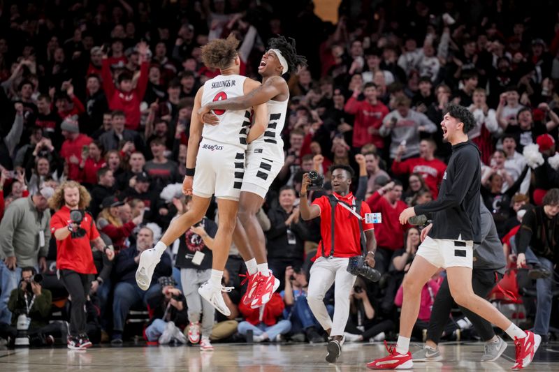 Jan 16, 2024; Cincinnati, Ohio, USA;  Cincinnati Bearcats guard Dan Skillings Jr., left, celebrates with guard Rayvon Griffith after defeating the TCU Horned Frogs as time expires in overtime at Fifth Third Arena. Mandatory Credit: Aaron Doster-USA TODAY Sports