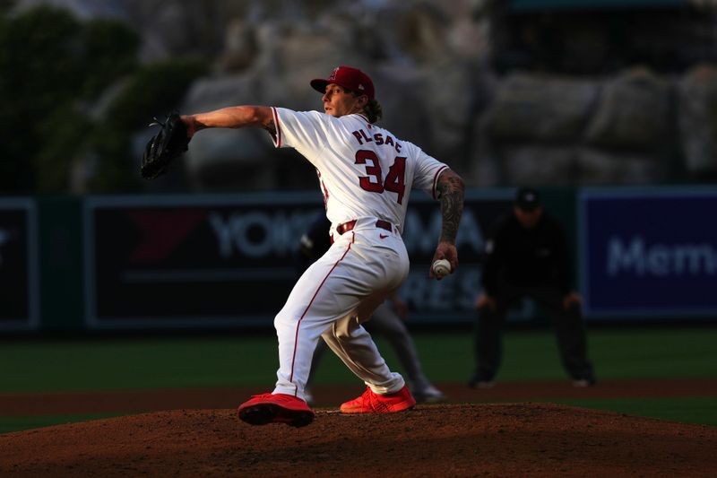 Jun 17, 2024; Anaheim, California, USA; Los Angeles Angels starting pitcher Zach Plesac (34) throws in the third inning against the Milwaukee Brewers at Angel Stadium. Mandatory Credit: Kirby Lee-USA TODAY Sports