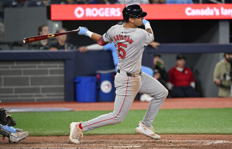 Sep 24, 2024; Toronto, Ontario, CAN;  Boston Red Sox second baseman Vaughn Grissom (5) hits a single against the Toronto Blue Jays in the eighth inning at Rogers Centre. Mandatory Credit: Dan Hamilton-Imagn Images