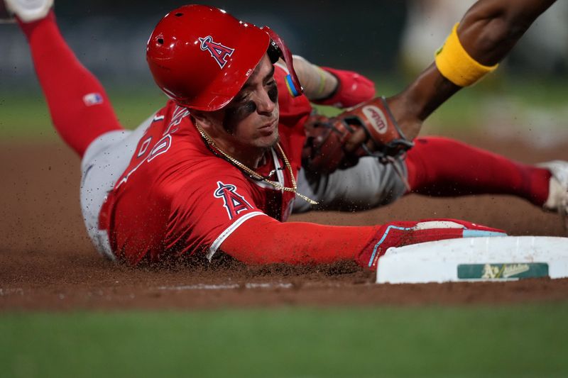 May 21, 2025; West Sacramento, California, USA; Los Angeles Angels shortstop Zach Neto (9) steals third base against the Athletics in the ninth inning at Sutter Health Park. Mandatory Credit: Cary Edmondson-Imagn Images