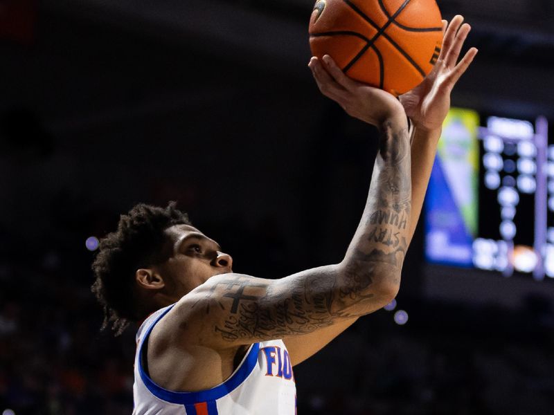 Feb 28, 2024; Gainesville, Florida, USA; Florida Gators guard Will Richard (5) shoots a three-point shot against the Missouri Tigers during the second half at Exactech Arena at the Stephen C. O'Connell Center. Mandatory Credit: Matt Pendleton-USA TODAY Sports