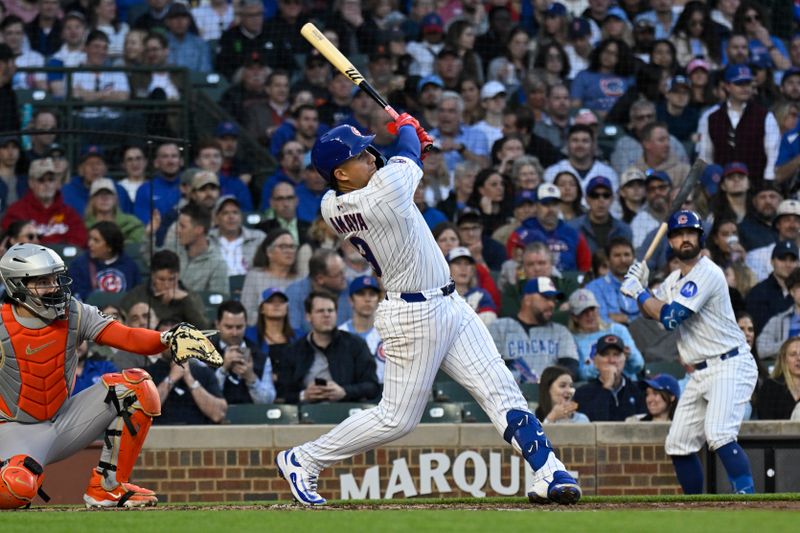 May 6, 2025; Chicago, Illinois, USA;  Chicago Cubs catcher Miguel Amaya (9) hits a two run home run during the third inning against the San Francisco Giants at Wrigley Field. Mandatory Credit: Matt Marton-Imagn Images