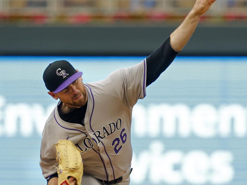 Jun 12, 2024; Minneapolis, Minnesota, USA; Colorado Rockies starting pitcher Austin Gomber (26) throws to the Minnesota Twins in the first inning at Target Field. Mandatory Credit: Bruce Kluckhohn-USA TODAY Sports