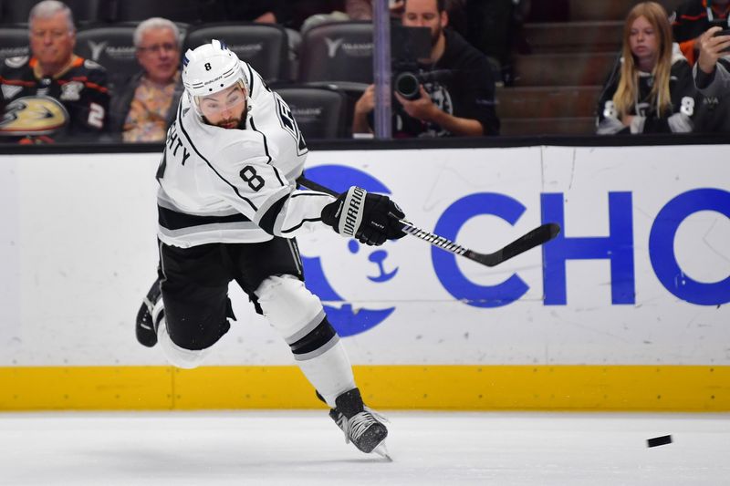 Nov 24, 2023; Anaheim, California, USA; Los Angeles Kings defenseman Drew Doughty (8) shoots on goal against the Anaheim Ducks during the first period at Honda Center. Mandatory Credit: Gary A. Vasquez-USA TODAY Sports