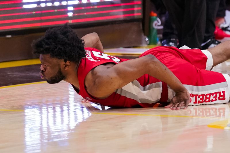 Feb 8, 2023; Laramie, Wyoming, USA; UNLV Runnin' Rebels guard EJ Harkless (55) battles for the loose ball against  the Wyoming Cowboys during the second half at Arena-Auditorium. Mandatory Credit: Troy Babbitt-USA TODAY Sports