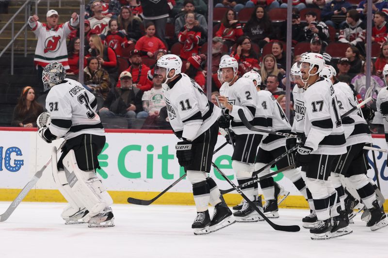 Mar 14, 2026; Newark, New Jersey, USA; Los Angeles Kings center Anze Kopitar (11) celebrates his goal against the New Jersey Devils during the third period at Prudential Center. Kopitar became the Kings all-time leading scorer with the goal.  Mandatory Credit: Ed Mulholland-Imagn Images