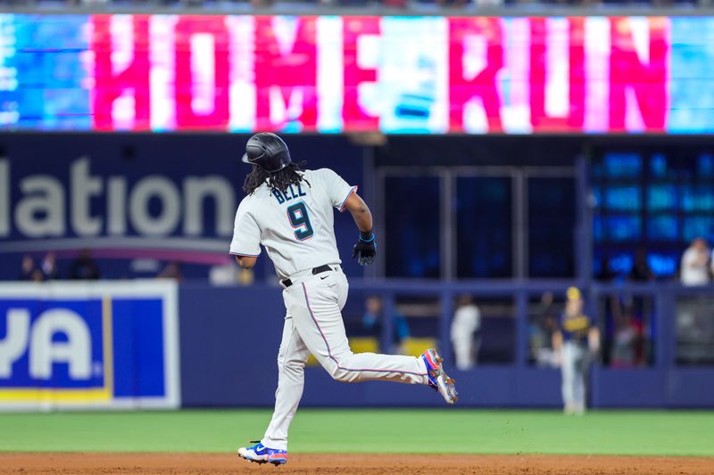 Sep 24, 2023; Miami, Florida, USA; Miami Marlins first baseman Josh Bell (9) circles the bases after hitting a home run against the Milwaukee Brewers during the third inning at loanDepot Park. Mandatory Credit: Sam Navarro-USA TODAY Sports