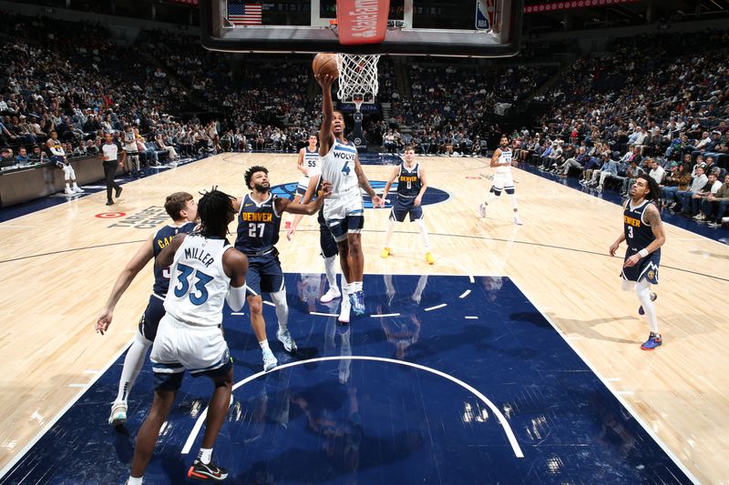 MINNEAPOLIS, MN -  OCTOBER 17: Rob Dillingham #4 of the Minnesota Timberwolves drives to the basket during the game against the Denver Nuggets during the 2024 NBA Preseason on October 17, 2024 at Target Center in Minneapolis, Minnesota. NOTE TO USER: User expressly acknowledges and agrees that, by downloading and or using this Photograph, user is consenting to the terms and conditions of the Getty Images License Agreement. Mandatory Copyright Notice: Copyright 2024 NBAE (Photo by David Sherman/NBAE via Getty Images)