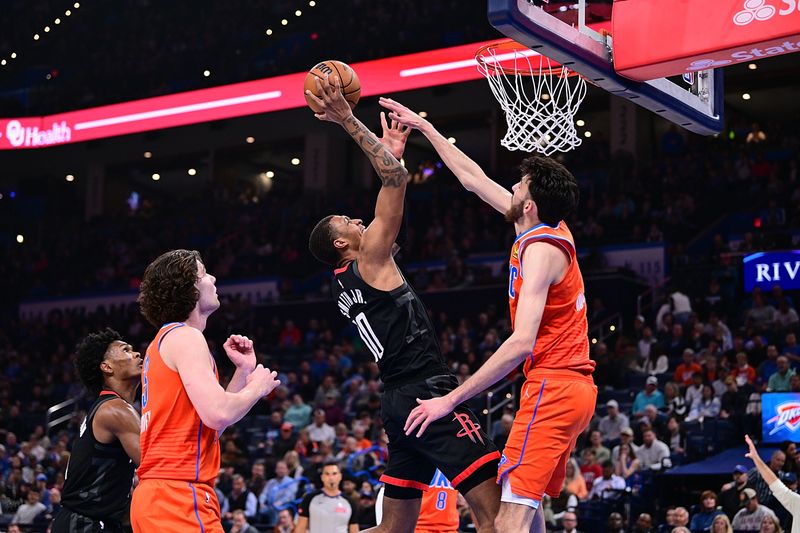 OKLAHOMA CITY, OKLAHOMA - MARCH 27: Jabari Smith Jr. #10 of the Houston Rockets attempts a shot over Chet Holmgren #7 of the Oklahoma City Thunder during the first half at Paycom Center on March 27, 2024 in Oklahoma City, Oklahoma. NOTE TO USER: User expressly acknowledges and agrees that, by downloading and or using this Photograph, user is consenting to the terms and conditions of the Getty Images License Agreement. (Photo by Joshua Gateley/Getty Images)