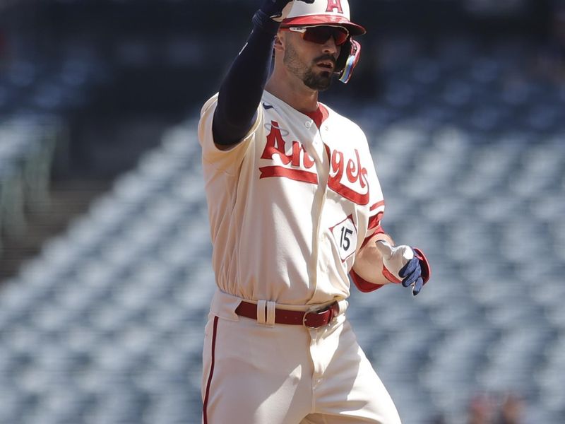 Sep 10, 2023; Anaheim, California, USA; Los Angeles Angels right fielder Randal Grichuk (15) gestures after hitting a double during the first inning of a game against the Cleveland Guardians at Angel Stadium. Mandatory Credit: Jessica Alcheh-USA TODAY Sports