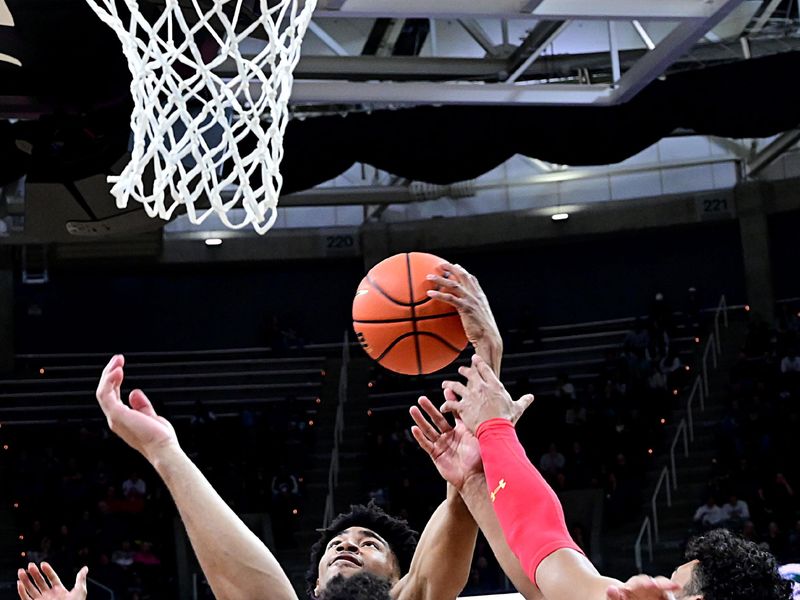 Feb 7, 2023; East Lansing, Michigan, USA;  Michigan State Spartans guard Jaden Akins (3) takes a rebound away from Maryland Terrapins forward Patrick Emilien (15) in the second half at Jack Breslin Student Events Center. Mandatory Credit: Dale Young-USA TODAY Sports