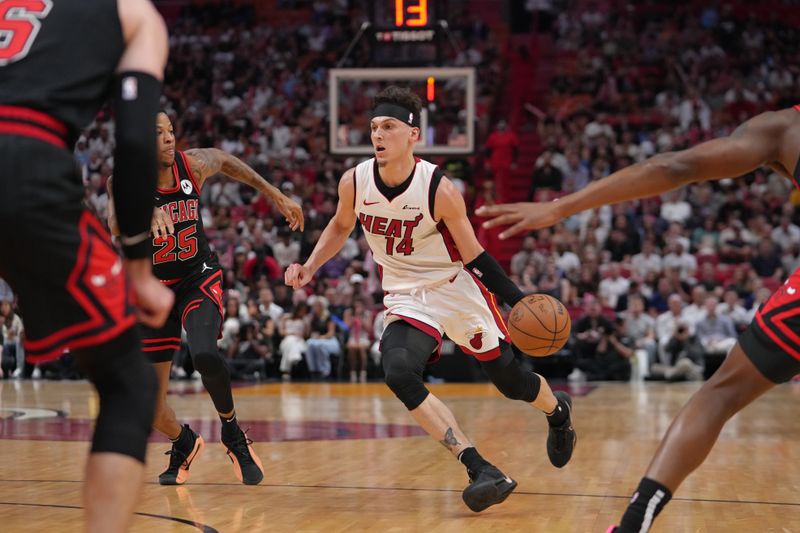 MIAMI, FL - APRIL 19: Tyler Herro #14 of the Miami Heat handles the ball during the game against the Chicago Bulls during the 2024 SoFi Play-In Tournament on April 19, 2024 at Kaseya Center in Miami, Florida. NOTE TO USER: User expressly acknowledges and agrees that, by downloading and or using this Photograph, user is consenting to the terms and conditions of the Getty Images License Agreement. Mandatory Copyright Notice: Copyright 2024 NBAE (Photo by Eric Espada/NBAE via Getty Images)