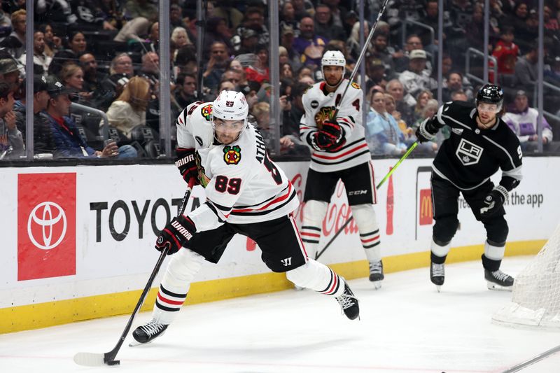 Mar 19, 2024; Los Angeles, California, USA;  Chicago Blackhawks center Andreas Athanasiou (89) controls the puck during the third period against the Los Angeles Kings at Crypto.com Arena. Mandatory Credit: Kiyoshi Mio-USA TODAY Sports