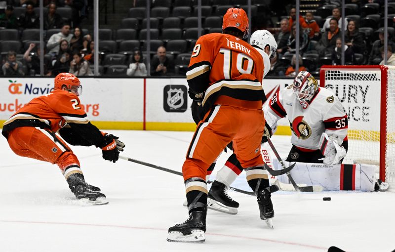 Dec 1, 2024; Anaheim, California, USA;  Ottawa Senators goaltender Linus Ullmark (35) deflects a shot by Anaheim Ducks defenseman Jackson LaCombe (2) during the overtime period at Honda Center. Mandatory Credit: Alex Gallardo-Imagn Images