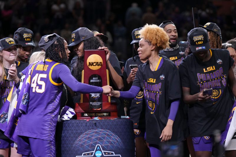 Apr 2, 2023; Dallas, TX, USA; The LSU Lady Tigers celebrate with the tournament trophy after defeating the Iowa Hawkeyes during the final round of the Women's Final Four NCAA tournament at the American Airlines Center. Mandatory Credit: Kirby Lee-USA TODAY Sports