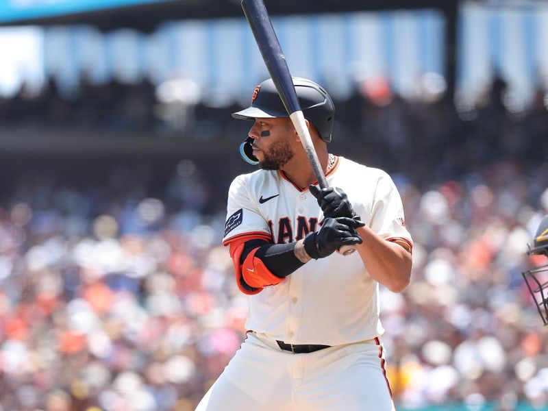Jun 5, 2025; San Francisco, California, USA; San Francisco Giants first baseman Dominic Smith (7) at bat against the San Diego Padres during the second inning at Oracle Park. Mandatory Credit: Kelley L Cox-Imagn Images