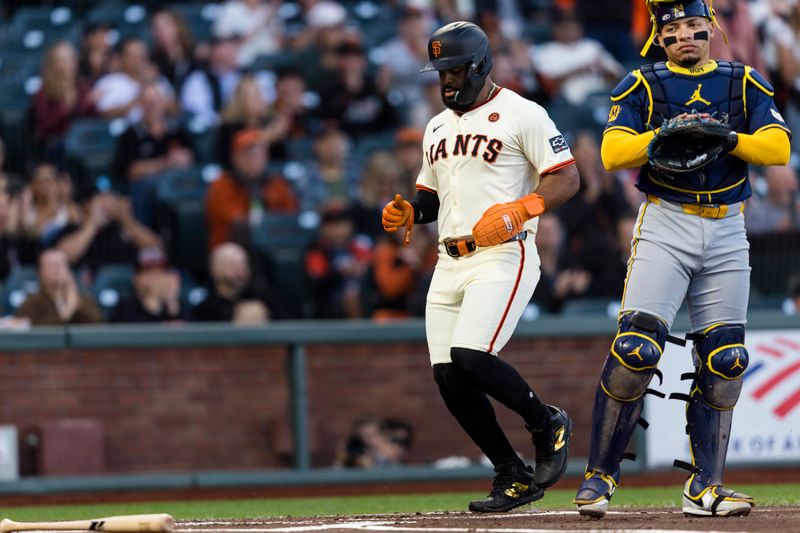 Sep 11, 2024; San Francisco, California, USA; San Francisco Giants left fielder Heliot Ramos (17) scores against the Milwaukee Brewers during the first inning at Oracle Park. Mandatory Credit: John Hefti-Imagn Images